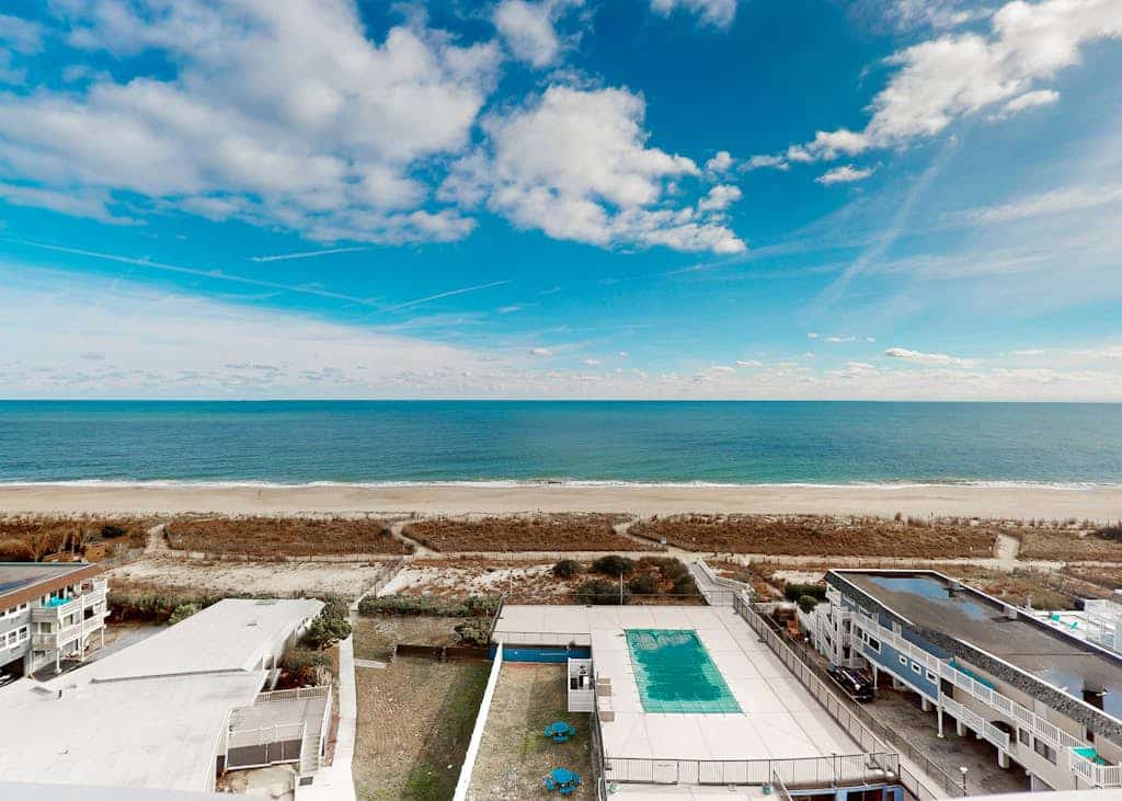 Beachfront condo with bay/ocean views, outdoor pool, & tennis courts