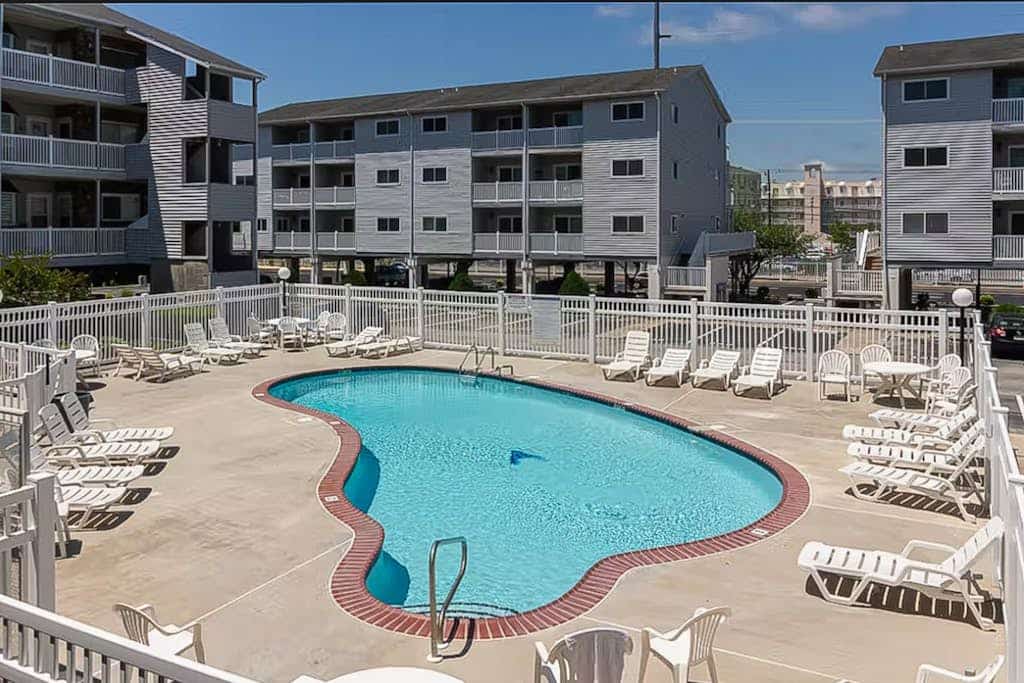 Coastal condo with a private washer/dryer, central AC, and a shared pool
