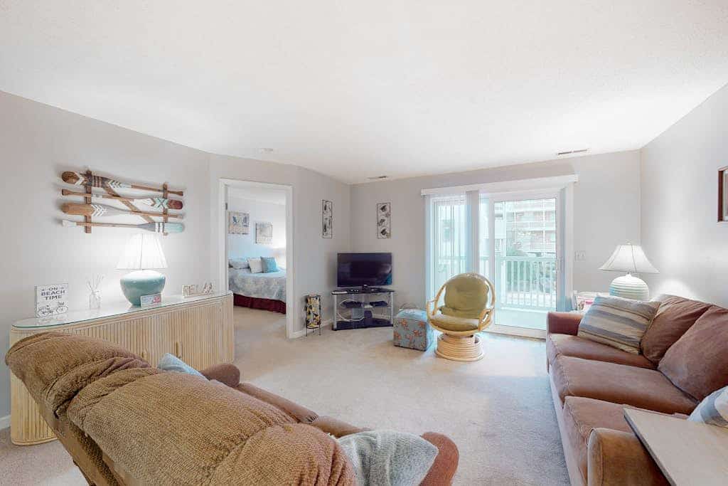 Coastal condo with a private washer/dryer, central AC, and a shared pool