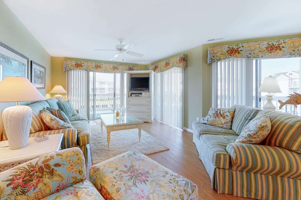 Waterfront escape with two pools, outdoor shower, balcony, WiFi & central AC