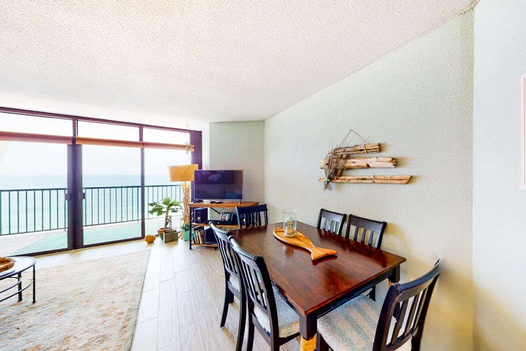 Updated beachfront condo with balcony, ocean view, WiFi, W/D, AC, & pool