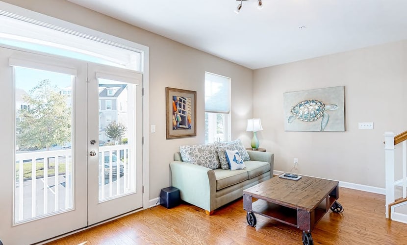 Dog-friendly, water-view townhome with shared pool, patio, grill
