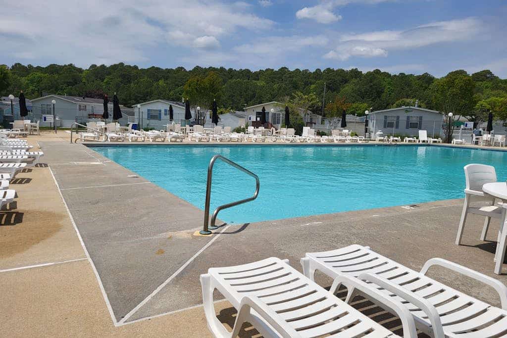 Sunny coastal home with private patio, on-site pool, central AC, & W/D