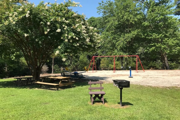 Sunny coastal home with private patio, on-site pool, central AC, & W/D