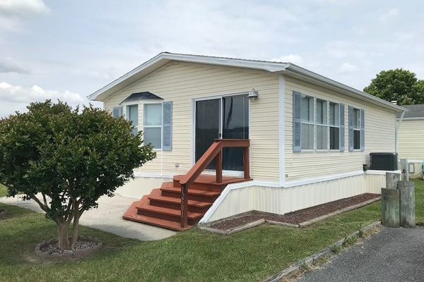 Sunny coastal home with private patio, on-site pool, central AC, & W/D