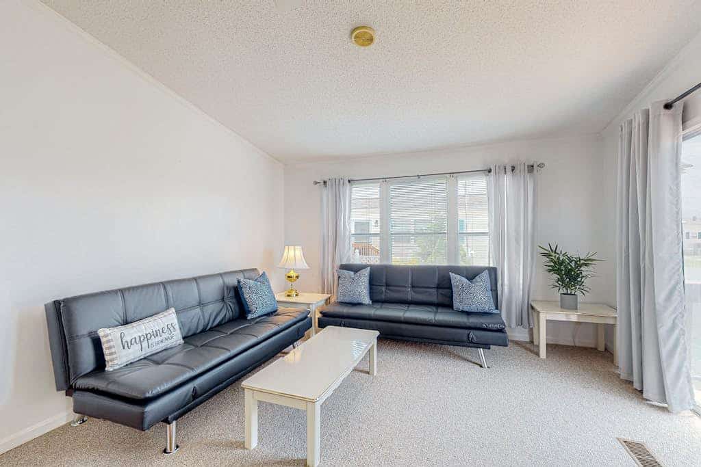Sunny coastal home with private patio, on-site pool, central AC, & W/D