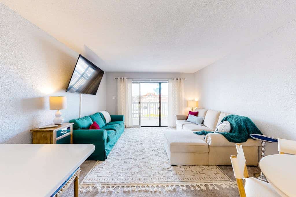Charming condo with balcony, central AC, washer/dryer, beach chairs, & WiFi
