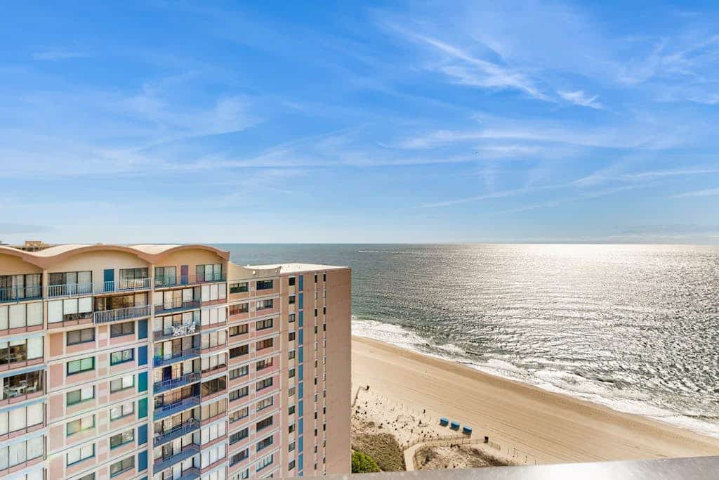 Beachfront resort condo with central AC, ocean views, balcony, pools & amenities