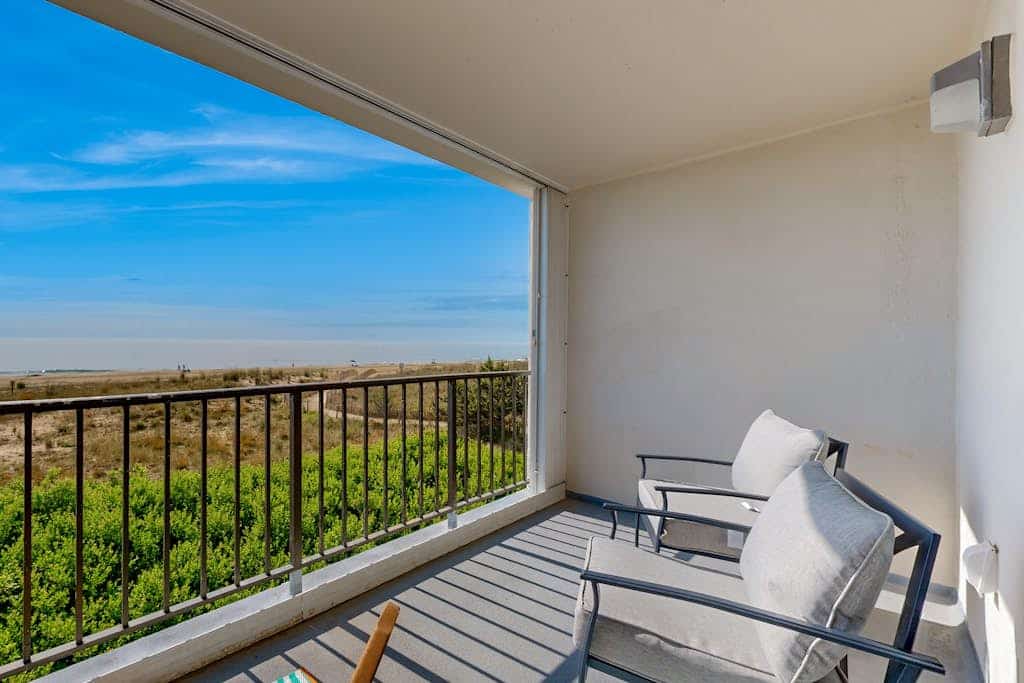 Waterfront perch with pool, private balcony, beach access, and WiFi