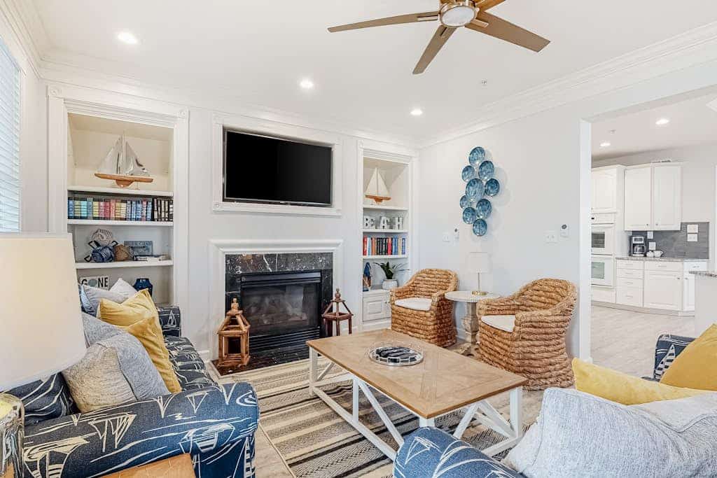Beachside home with a gas fireplace, washer/dryer, pools, dock, & fitness room