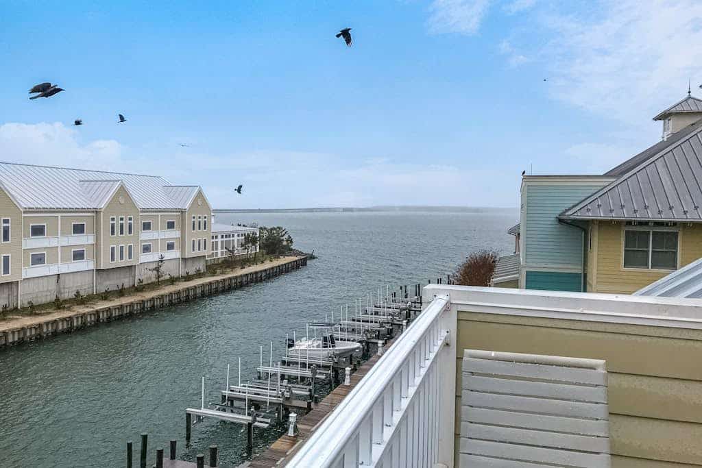 Beachside home with a gas fireplace, washer/dryer, pools, dock, & fitness room