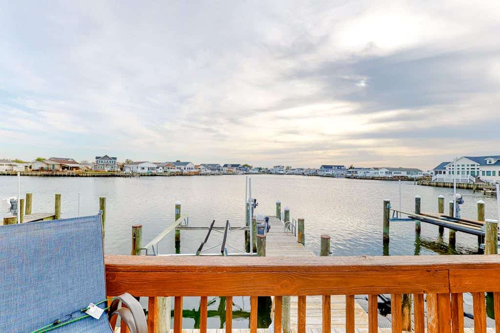 Canal front home with free WiFi, deck, private dock, shared pool & tennis