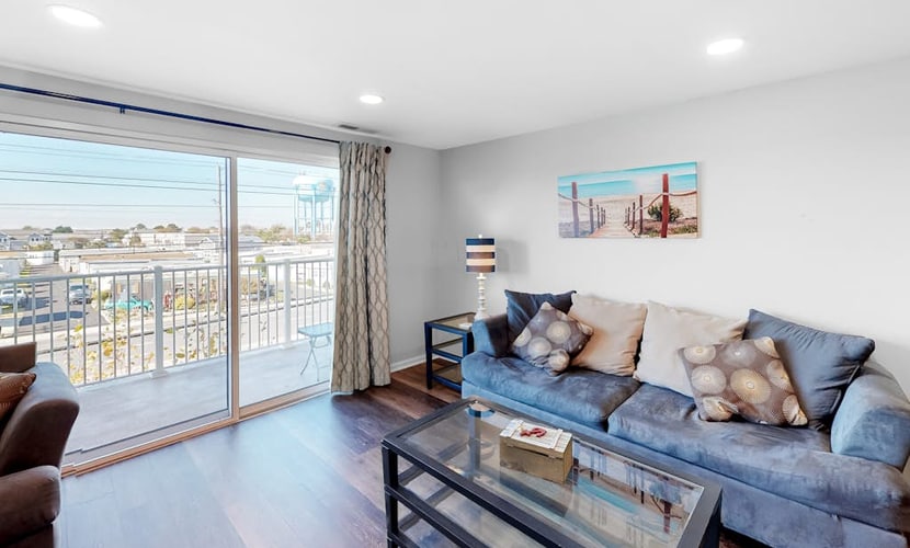 Condo One Block from the Beach w/ Balcony, AC, Laundry & Shared Pool