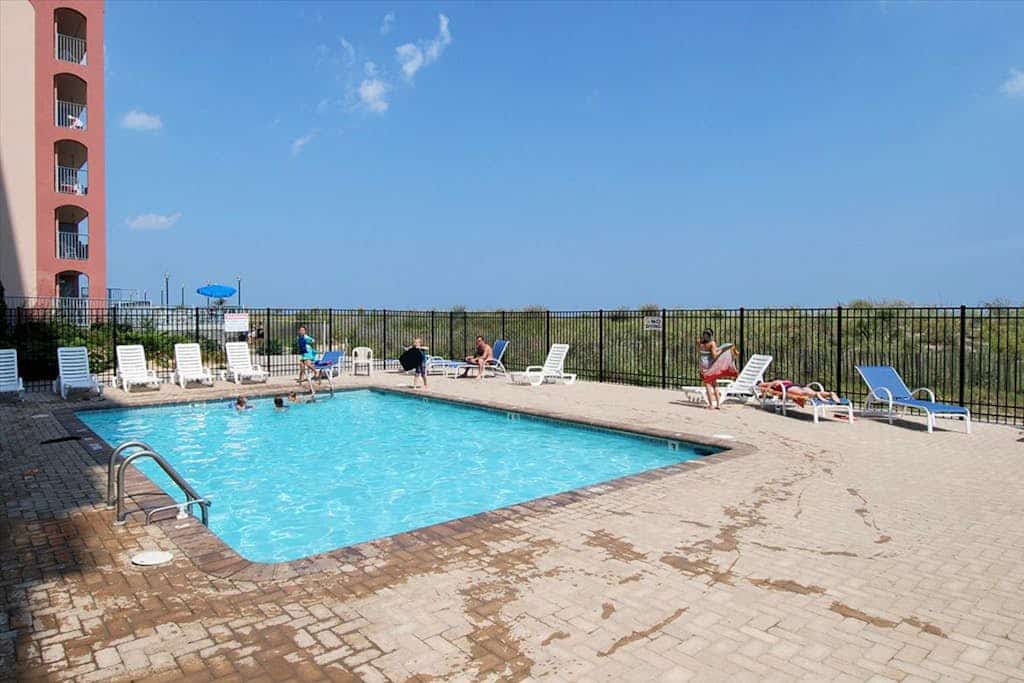 Oceanfront Condo with Balcony, WiFi, Central AC, W/D & Shared Outdoor Pool