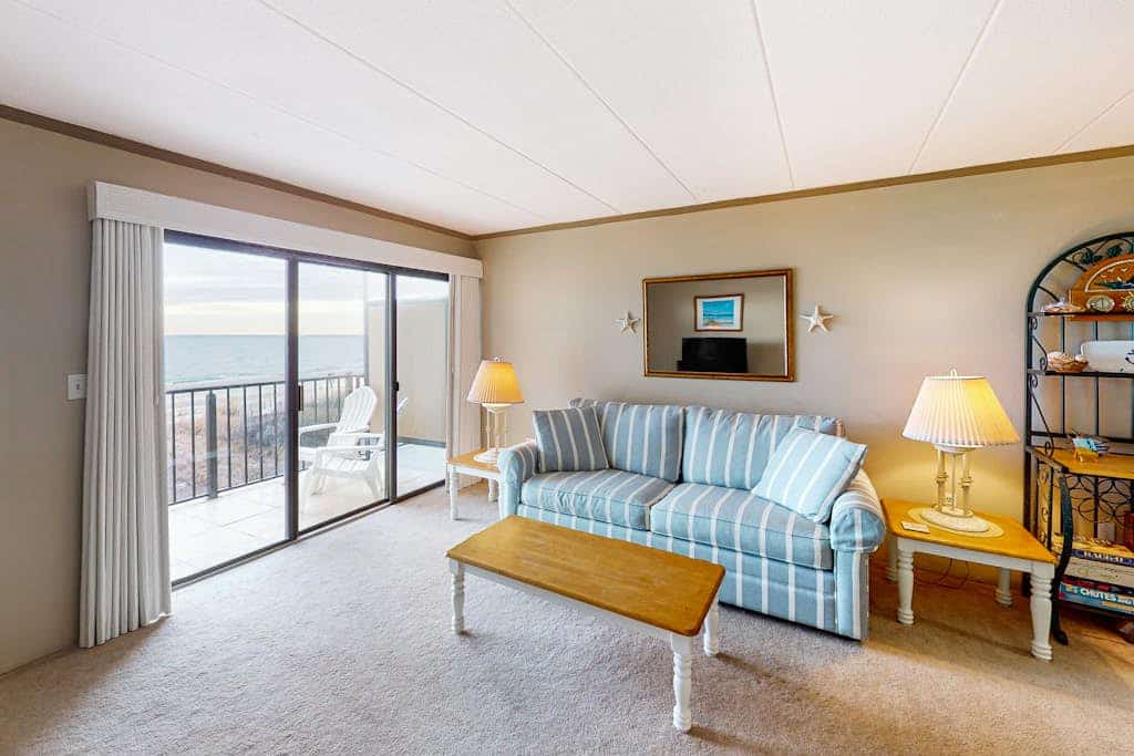 Oceanfront Condo with Balcony Overlooking the Beach, AC, WiFi & Laundry