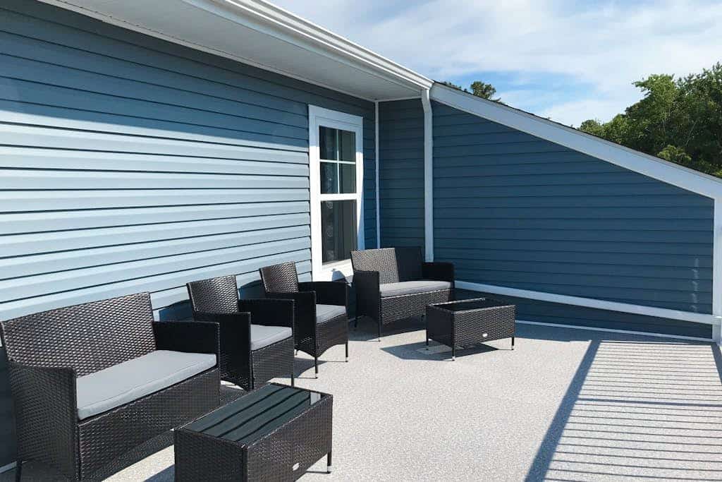 Newly built row-end townhome with water view, pool access, patio, & balcony
