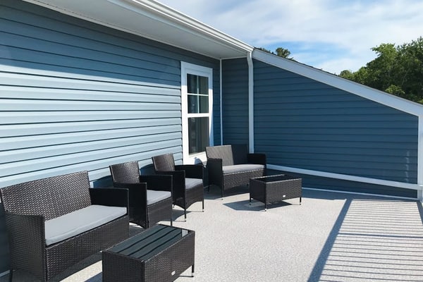 Newly built row-end townhome with water view, pool access, patio, & balcony