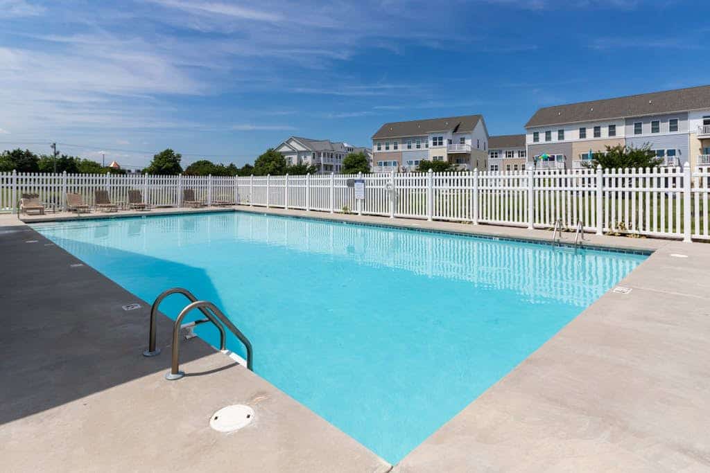 Bay-view townhome with private deck, pool access, central AC, & W/D