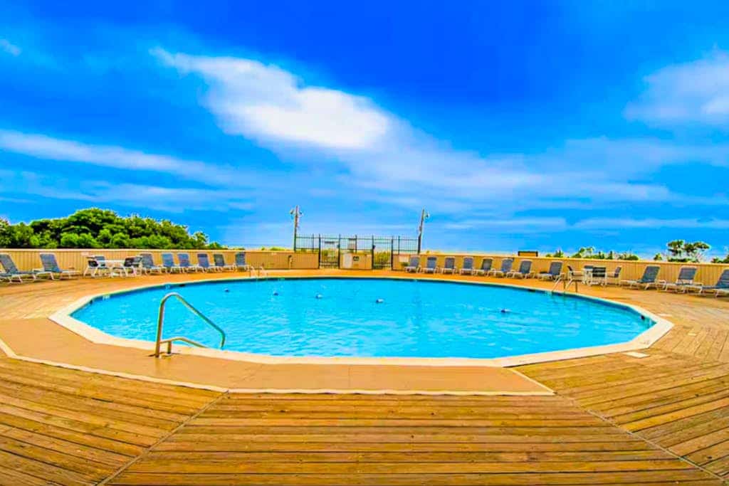 Beachfront condo with ocean views, pool, private balcony, & beach access