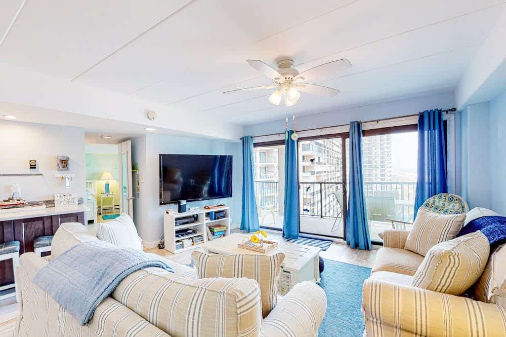 Beachfront condo with ocean views, pool, private balcony, & beach access
