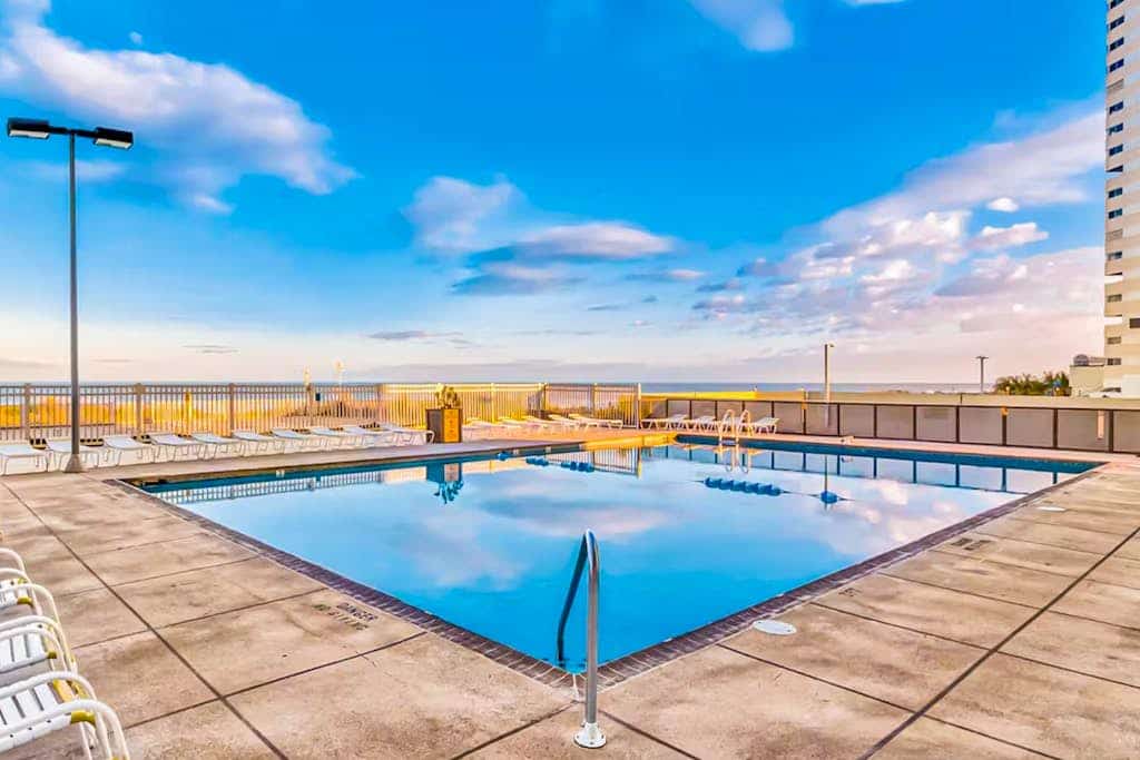 Beachfront condo with beach access, pools, sauna, game room, tennis, gym, W/D