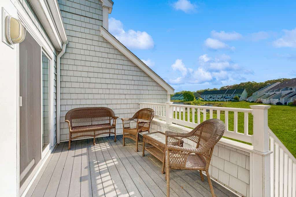 End-unit townhome with resort amenities, water view, balcony, fireplace, & AC
