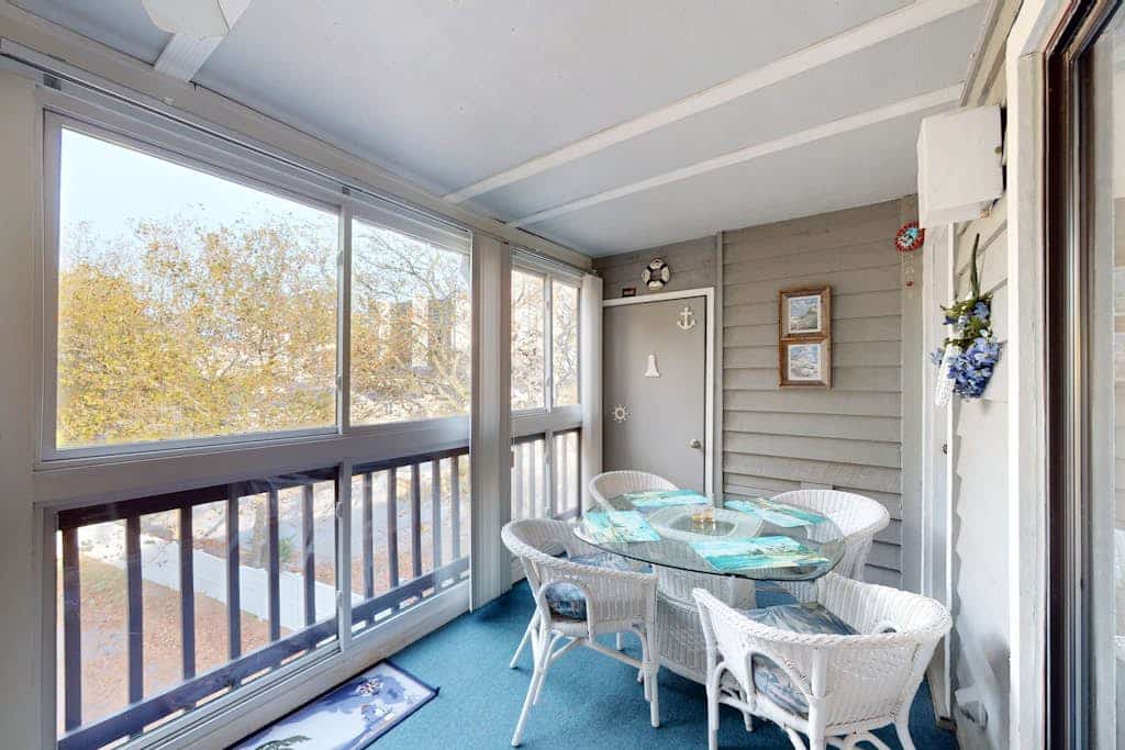 Coastal condo with shared pool, balcony, open layout, internet, W/D, & AC