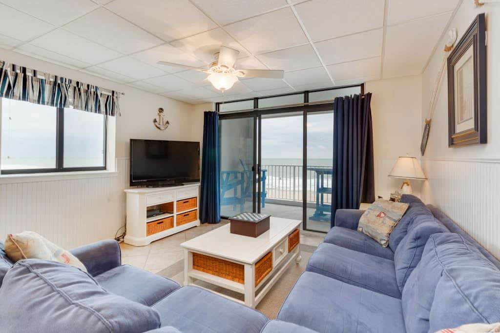 Waterfront condo w/ a furnished balcony, tranquil view, & full kitchen