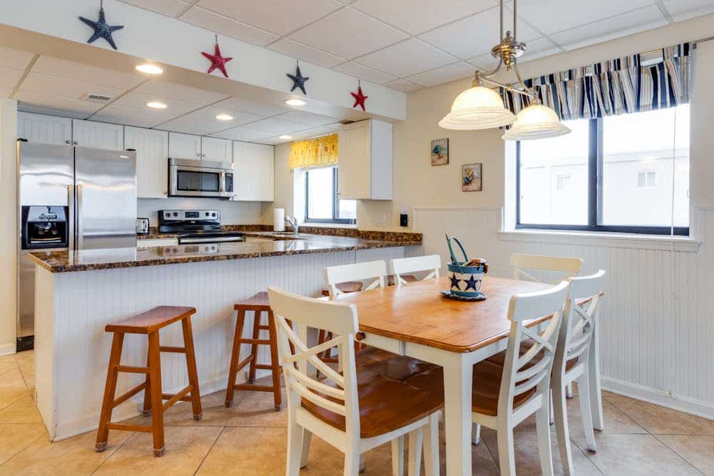 Waterfront condo w/ a furnished balcony, tranquil view, & full kitchen
