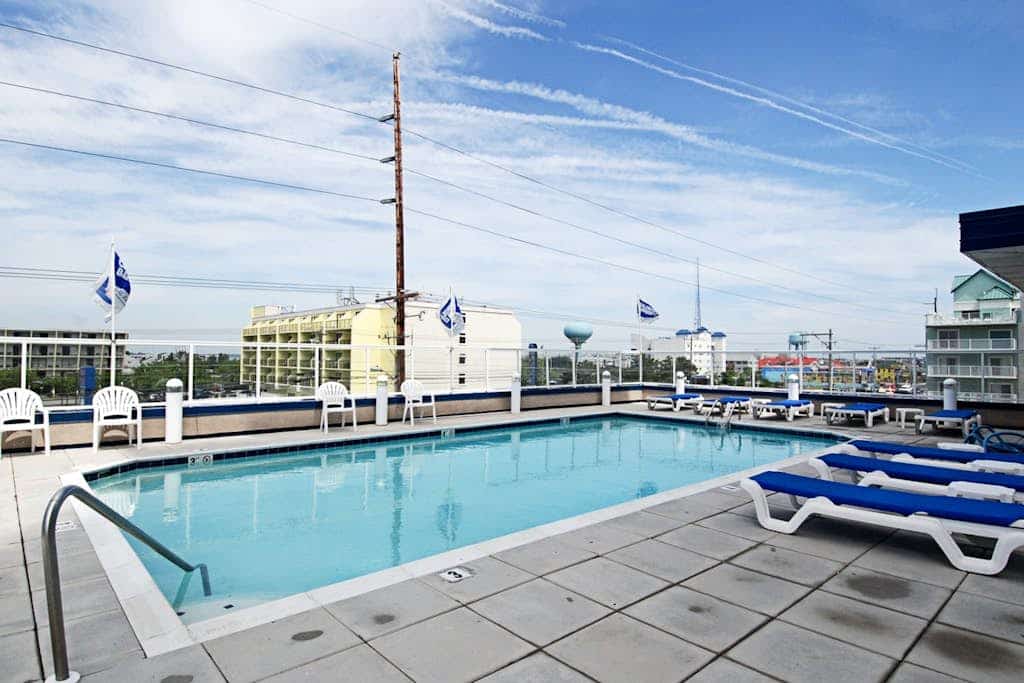 Ocean-view condo with balcony, central AC, W/D, pool, gym & coastal decor