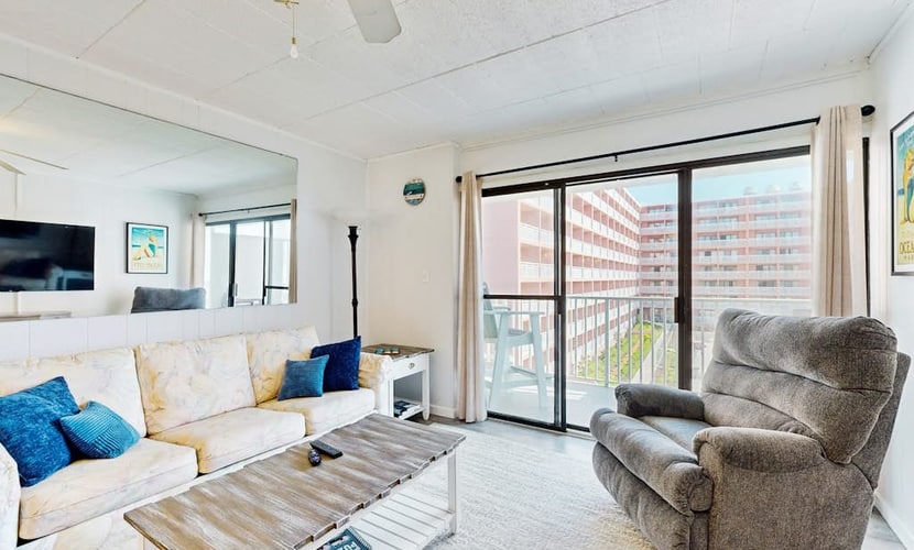 Mid-town, ocean-view condo with balcony & pool access - steps from the beach