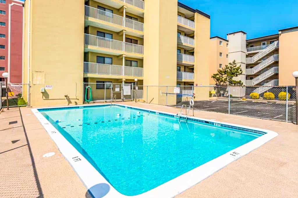 Mid-town, ocean-view condo with balcony & pool access - steps from the beach