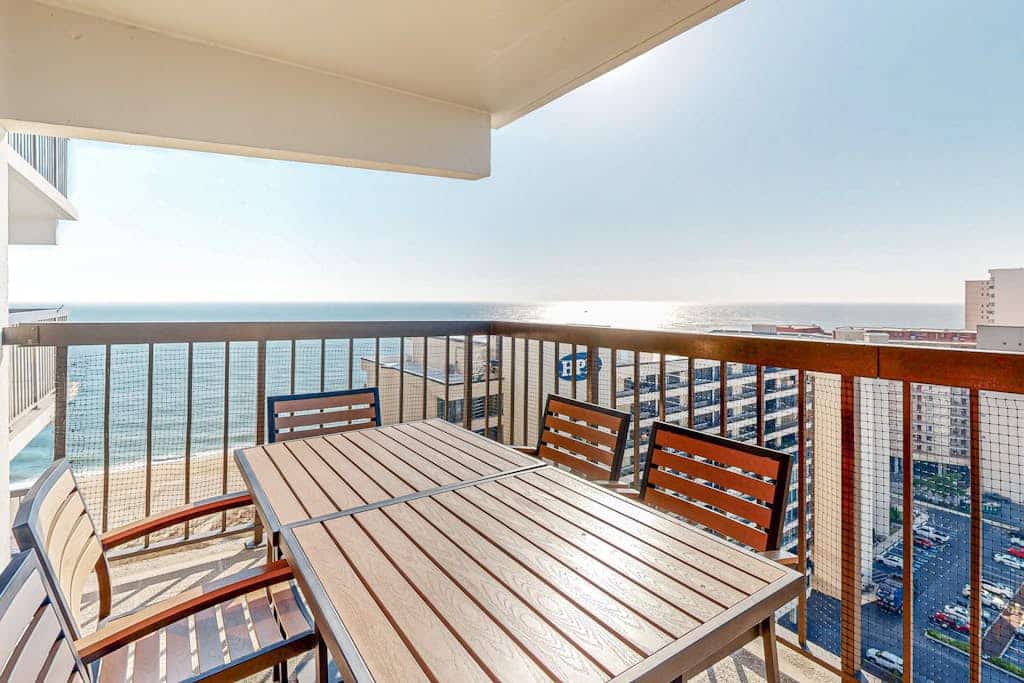 Coastal-themed beach condo with balcony, views, pools, tennis & central AC