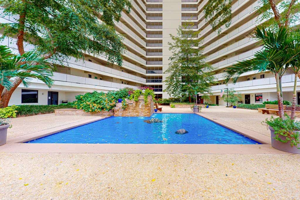 Coastal-themed beach condo with balcony, views, pools, tennis & central AC