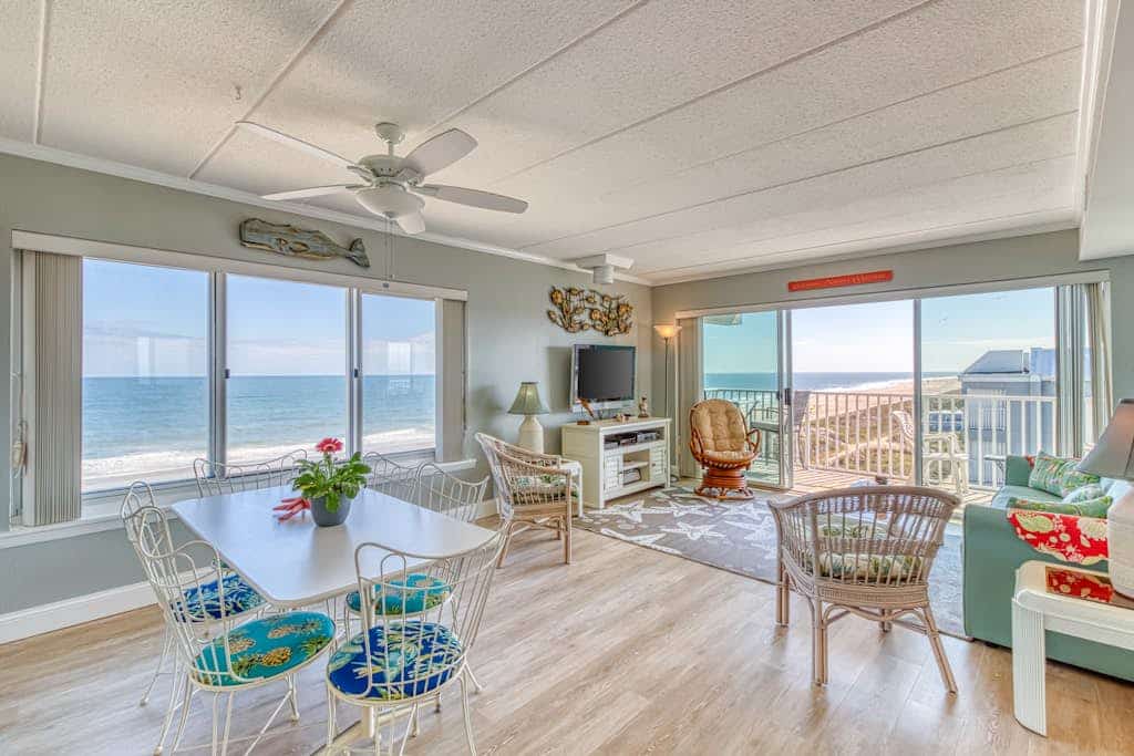 Bright beachfront condo with balcony, amazing views, W/D, & central AC