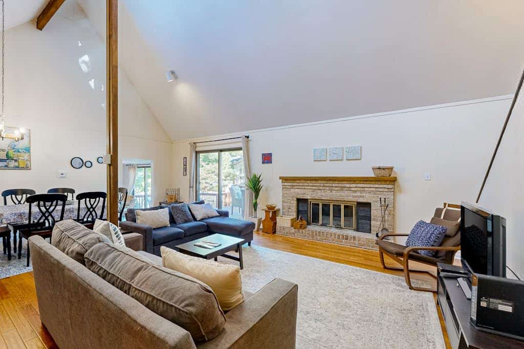 Home on canal with views, pool/tennis access, spacious deck & lovely interior