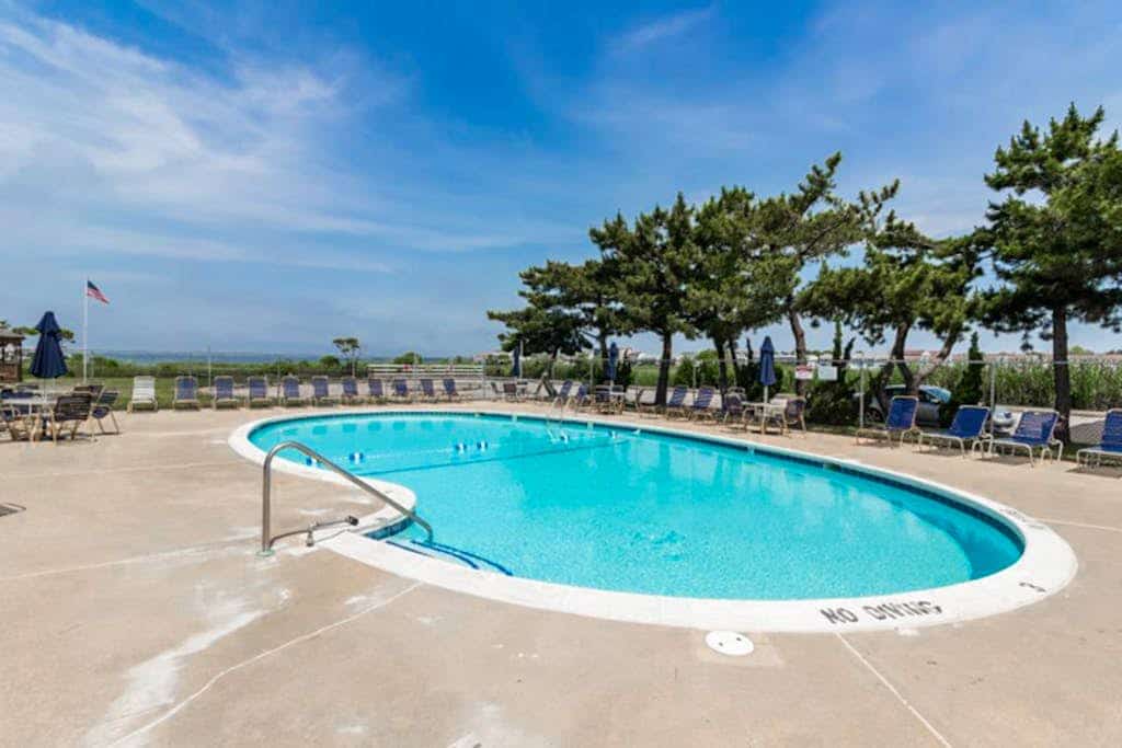 Cozy canal-side condo with pool, bay views, central AC, & deck - walk to beach