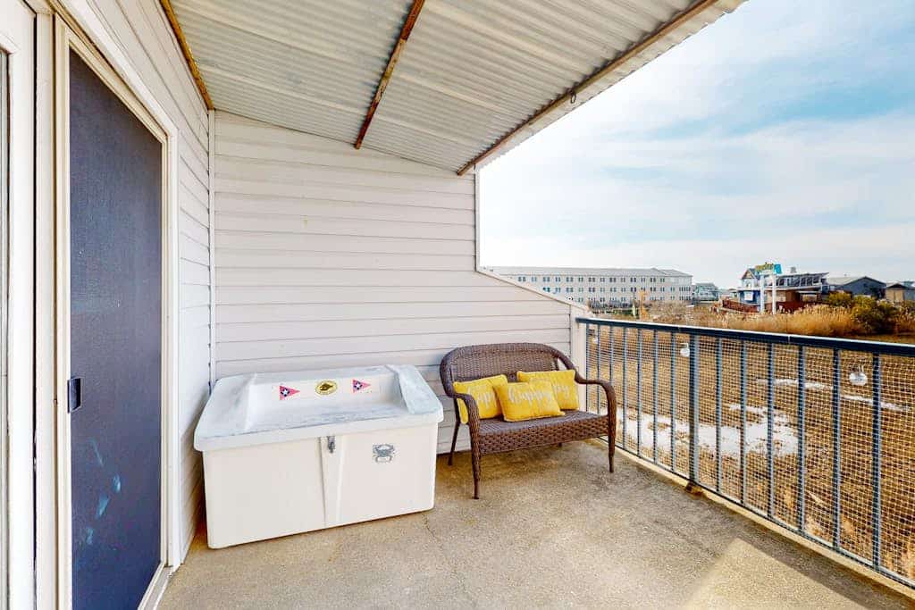 Waterfront condo with pool, balcony, games, central AC, smart TVs, & W/D