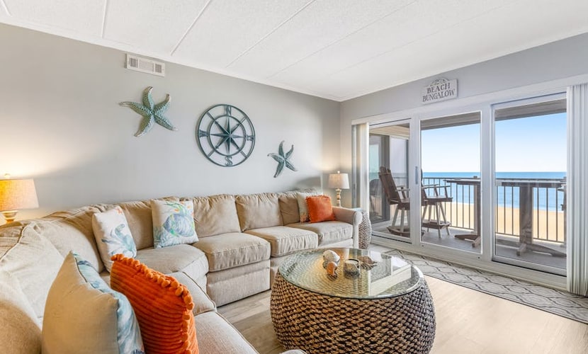 Oceanfront Pelican Beach condo with sunrise ocean views, AC, laundry & WiFi