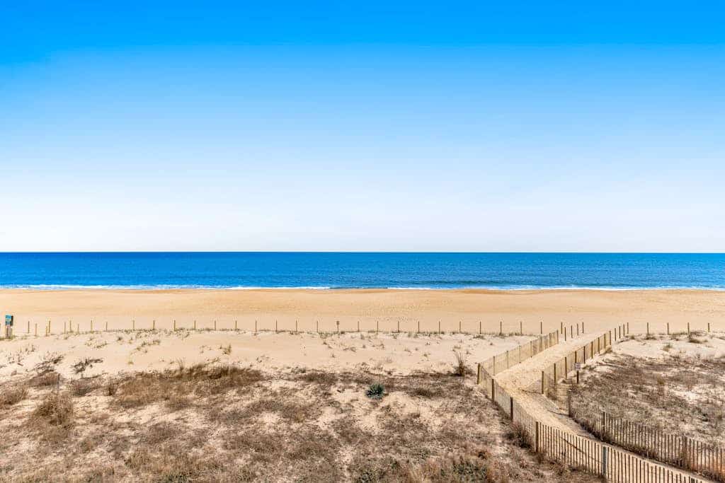 Oceanfront Pelican Beach condo with sunrise ocean views, AC, laundry & WiFi