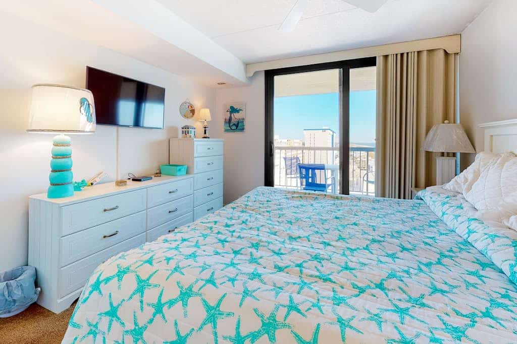 Private beach condo with balcony, washer/dryer, pools, gym & tennis courts