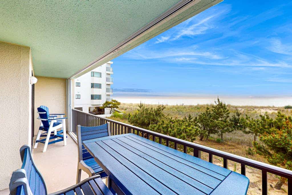 Oceanfront condo near golf with outdoor pool, balcony, central AC & washer/dryer