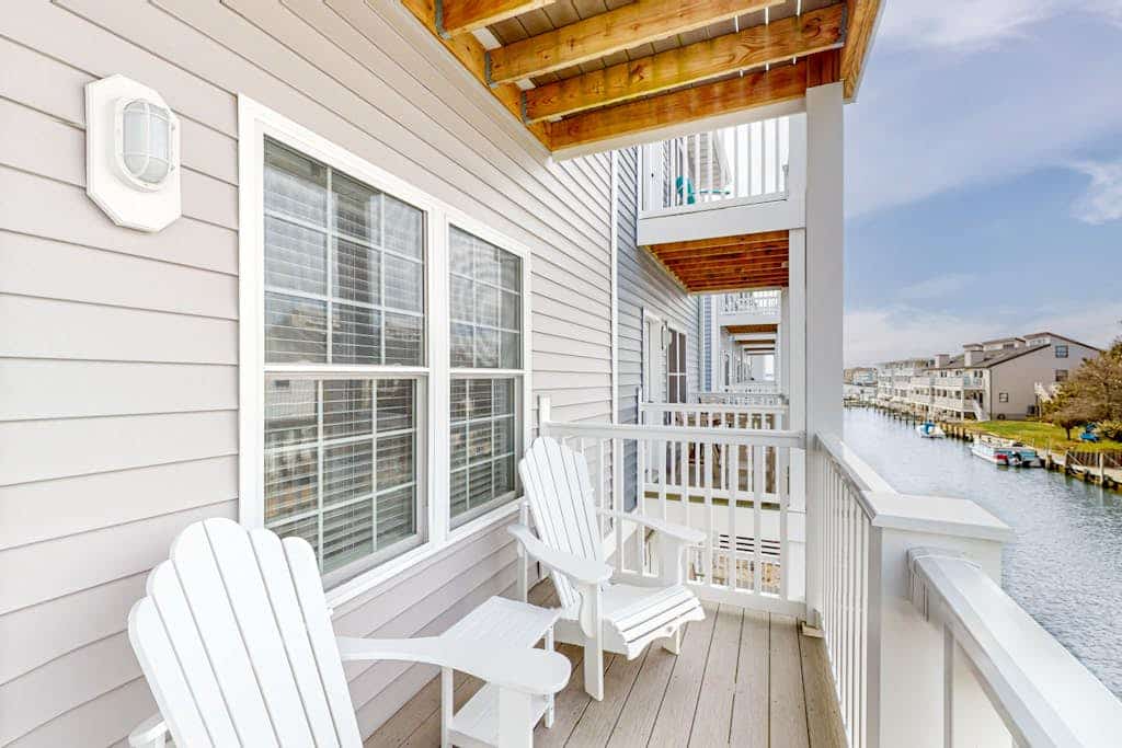 Upscale canal-front townhome with pool, beach access, dock, balconies, & desks