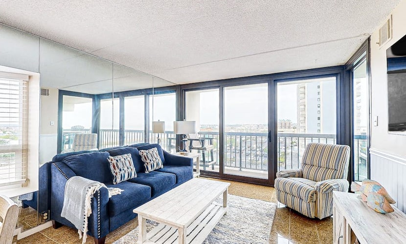 Luxury condo with bay and ocean views, pool, and beach access