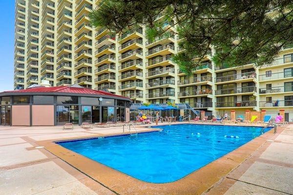 Luxury condo with bay and ocean views, pool, and beach access