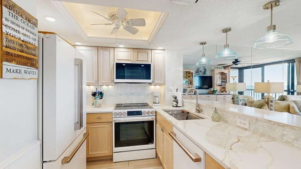 Gorgeous beachfront condo with balcony, pools, gym & game room