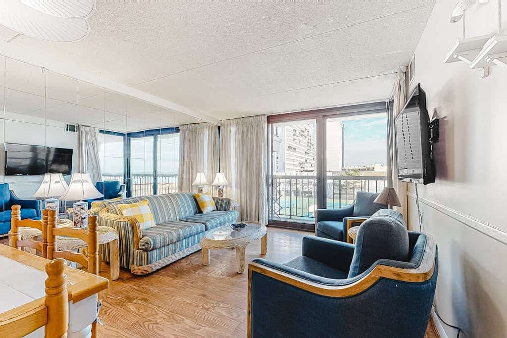 Welcoming beach retreat with tennis court views, pools, gym & sauna