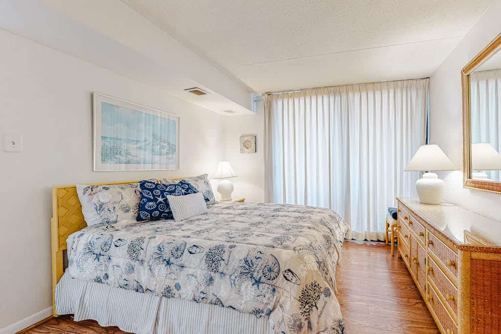 Welcoming beach retreat with tennis court views, pools, gym & sauna