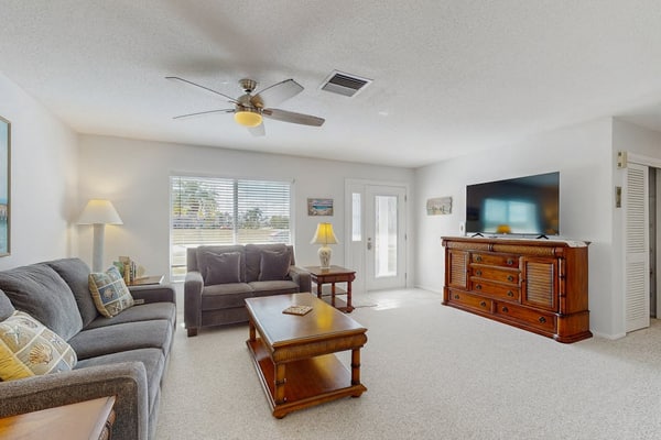 Coastal home with private, saltwater pool, gas grill, and internet