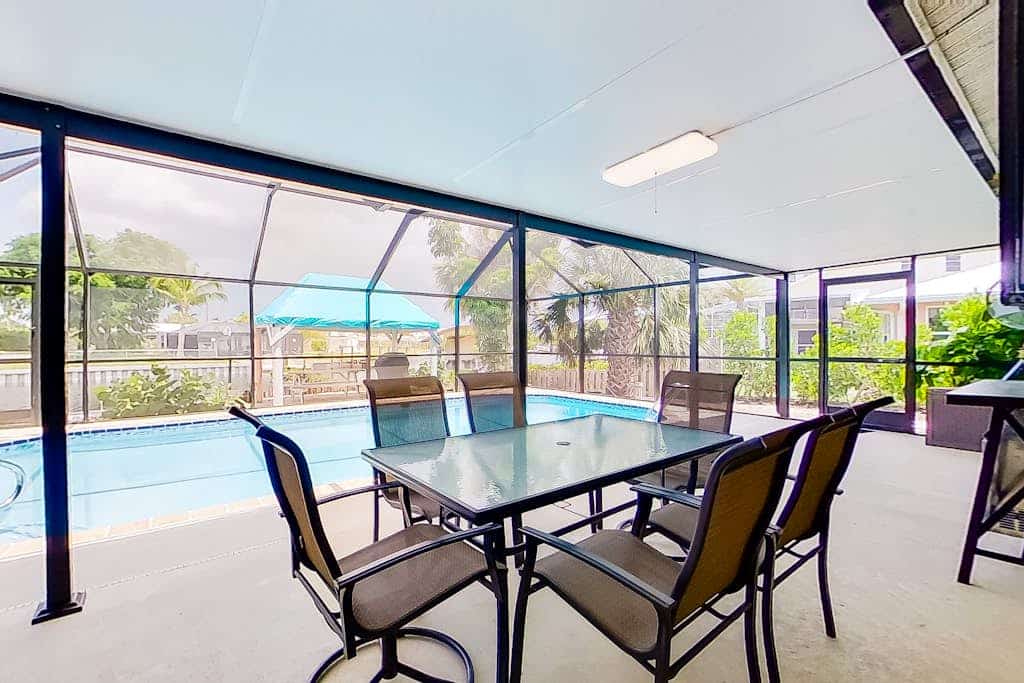 Private home on the canal with dock, screened pool, patio, AC, & W/D - dog-friendly